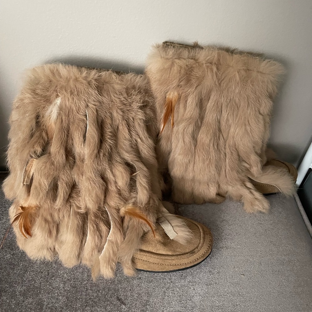 Booties are made with faux suede, the hanging fringes are real fur.